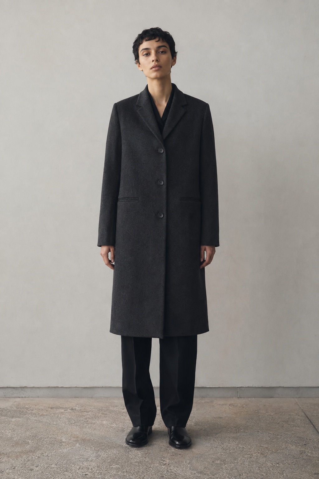 Charcoal wool coat in soft daylight