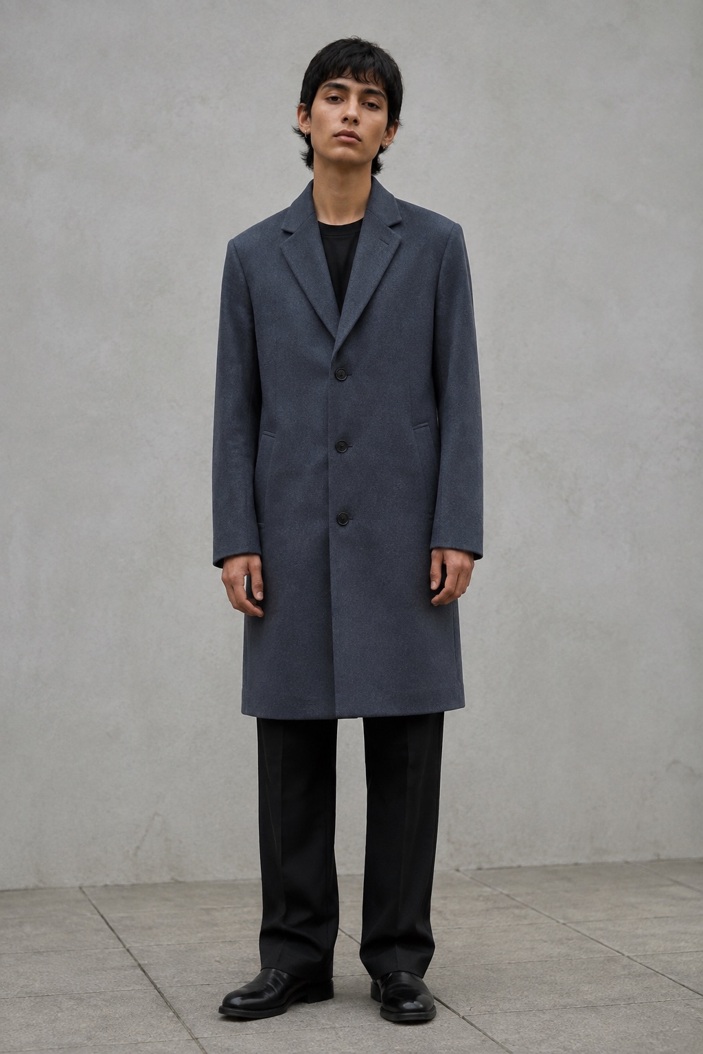 Slate wool coat with notched lapels, worn with dark trousers