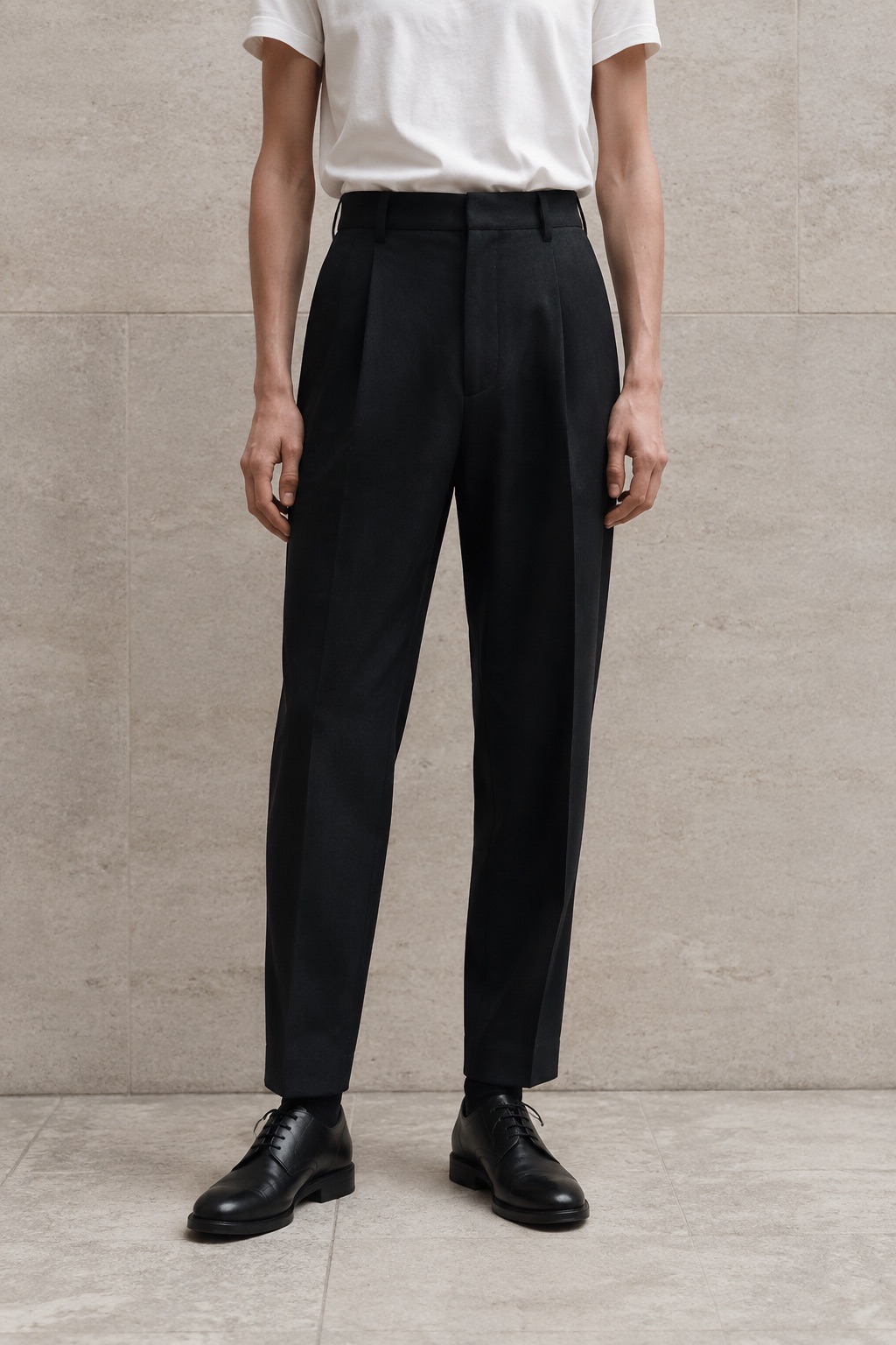 Ink tapered wool trousers with a white T-shirt and black shoes