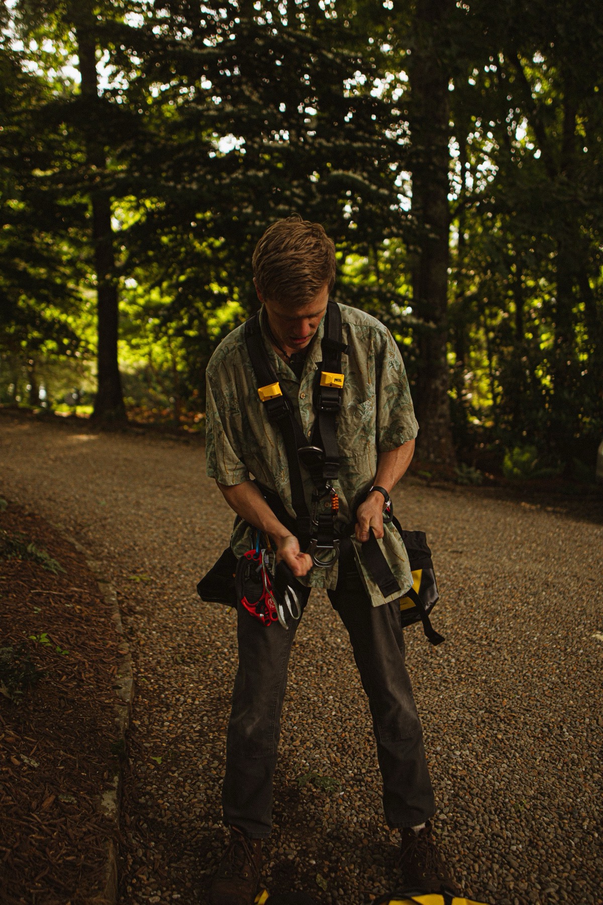 Wes Halvorsen in the driveway, checking his harness before going up