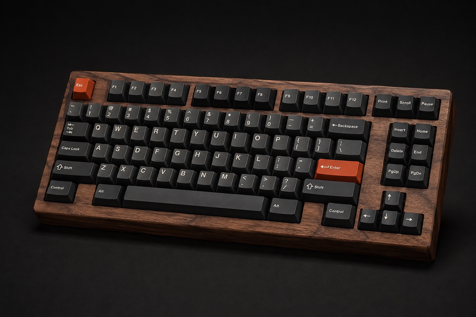 Kiln tenkeyless keyboard with an oiled walnut case, dark brown keycaps, and burnt-orange accents.